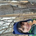 outdoor school participant hiding nature birdfeeder