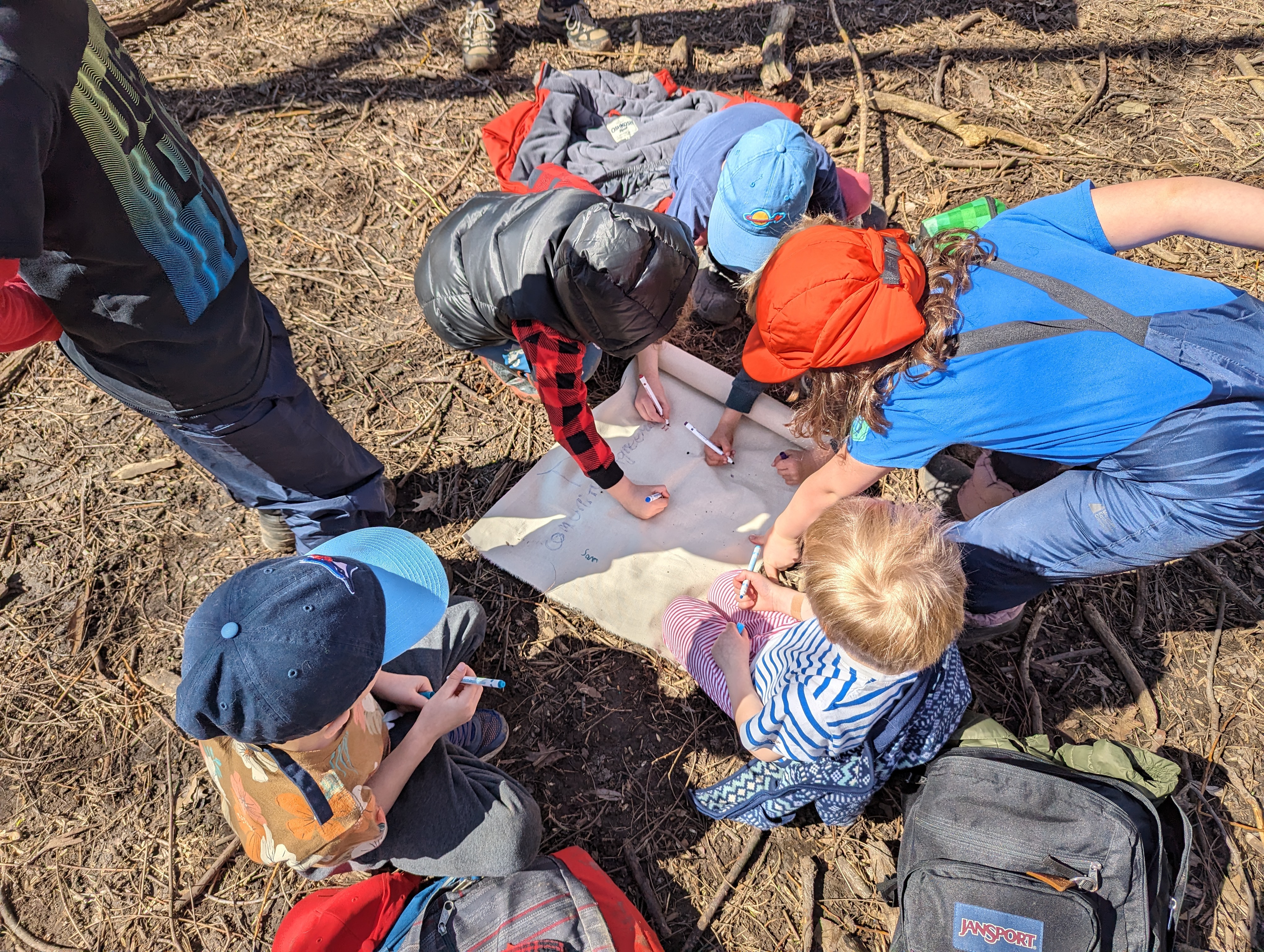 kids writing in scroll